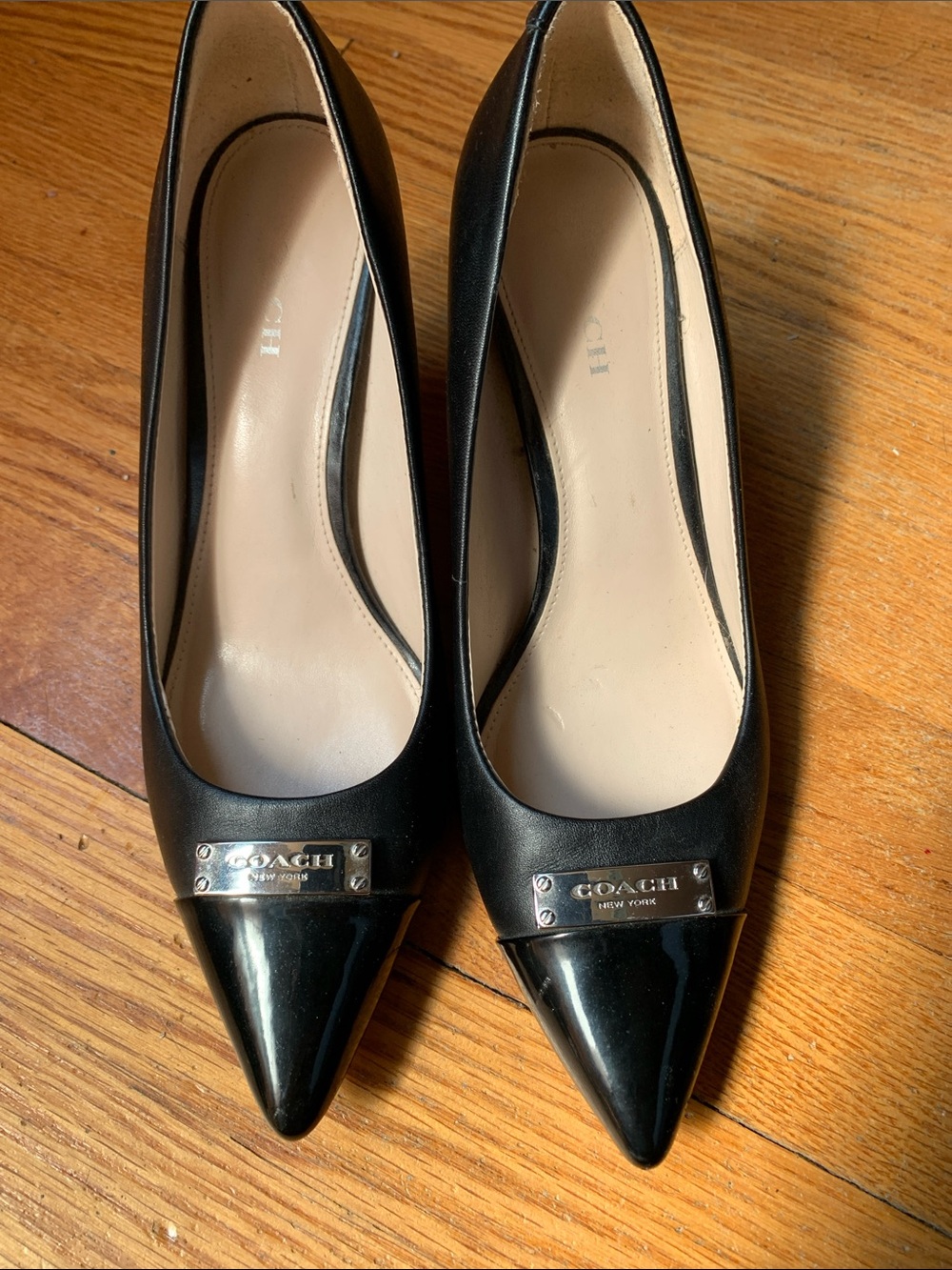 Coach Black Leather and Patent Pointed Toe Pumps with Silver Plaque